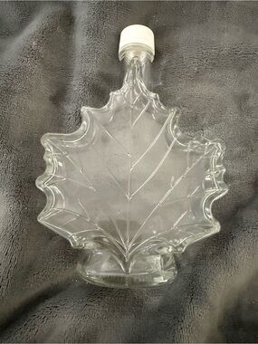 Source Unknown Clear Glass Maple Leaf Bottle with White Cap